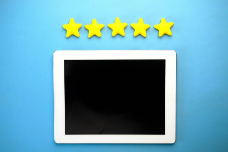 Customer leaving a five star review for a local business on a smartphone