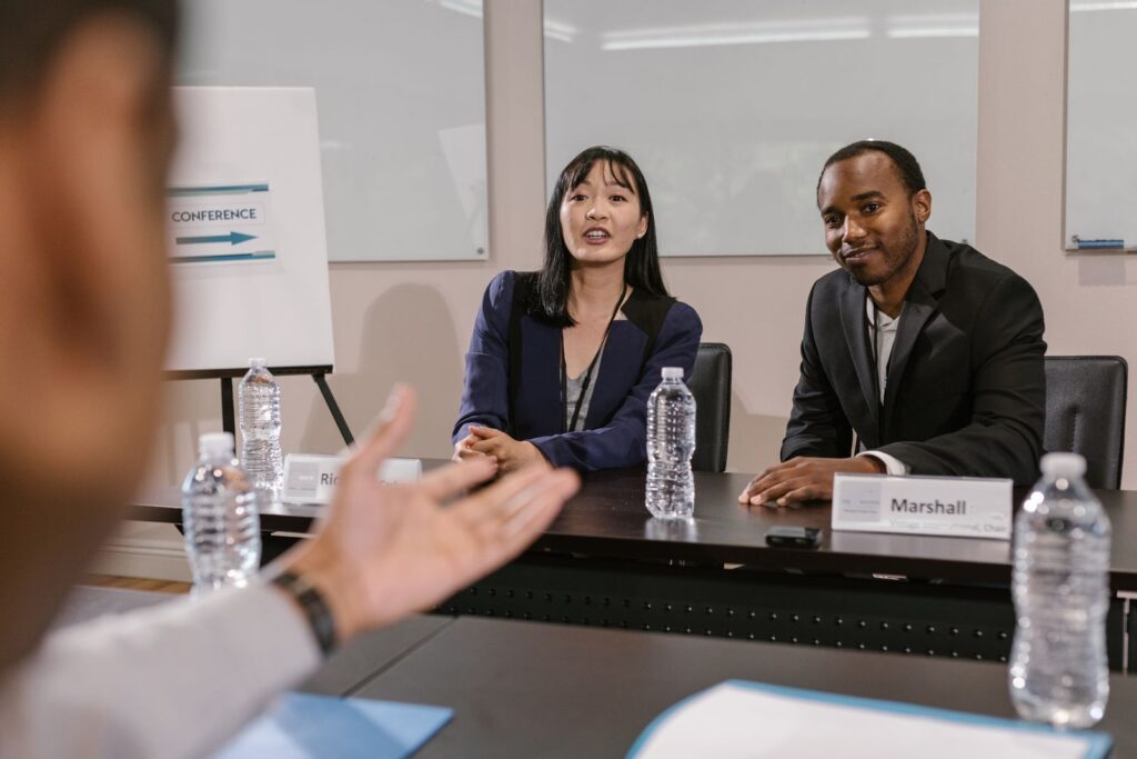 Small business owner interviewing a Google Ads agency at a desk