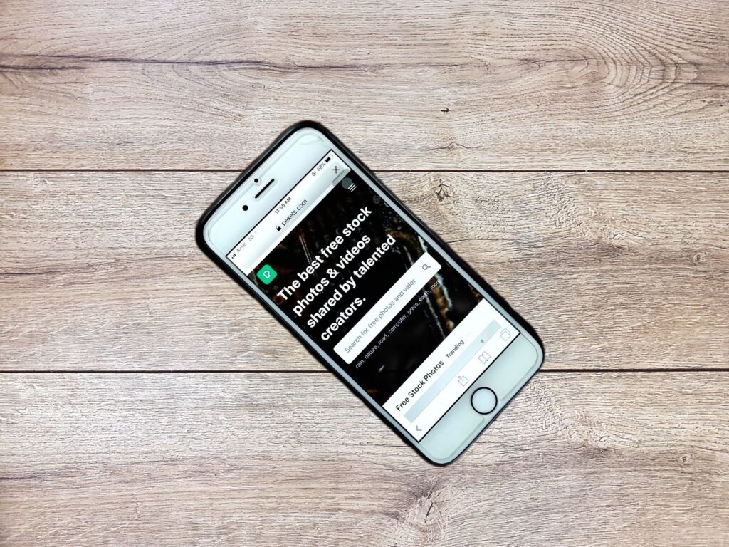 Business owner reviewing a landing page on a smartphone for common landing page mistakes
