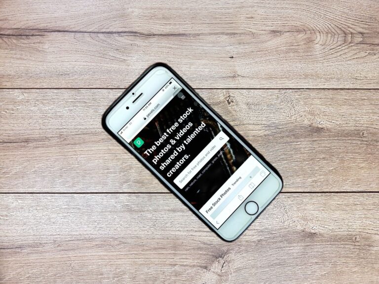 Business owner reviewing a landing page on a smartphone for common landing page mistakes